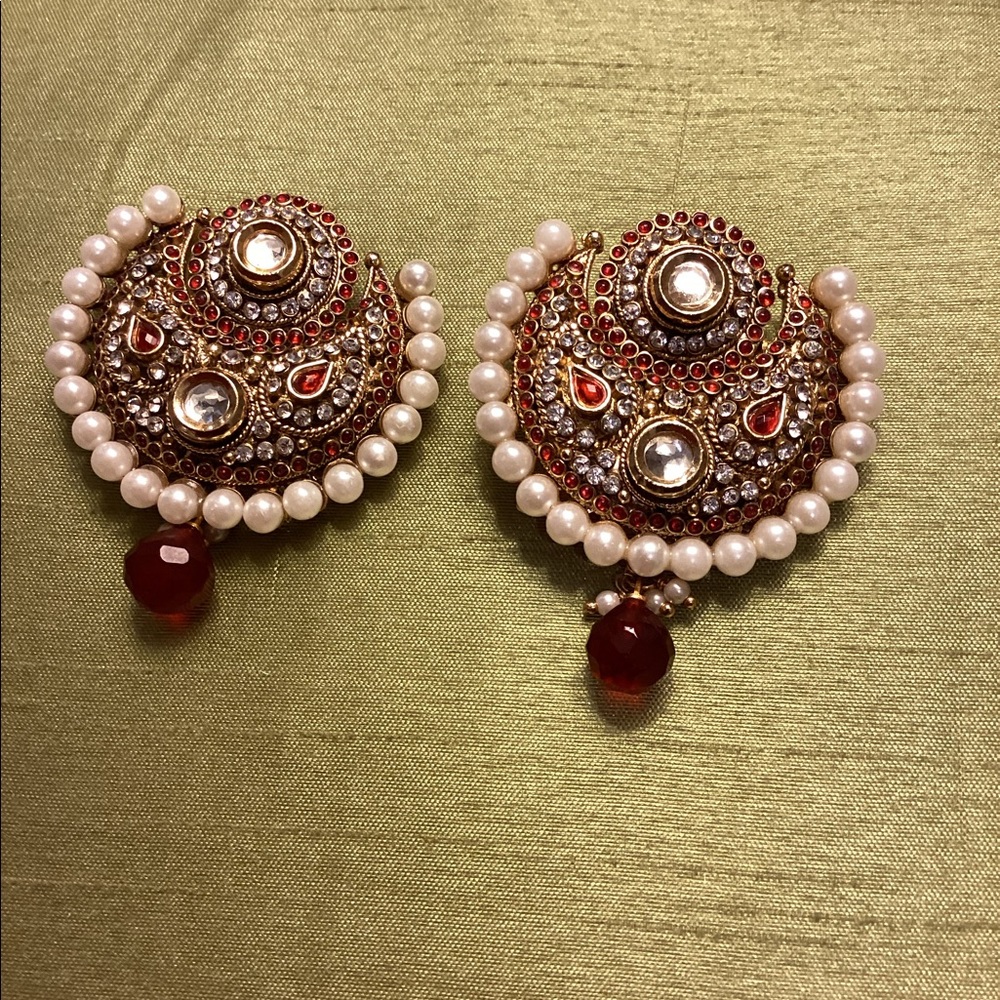Earrings dressy and statement piece.